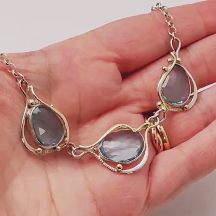Load video: Blue Topaz Necklace in Sterling Silver and Gold