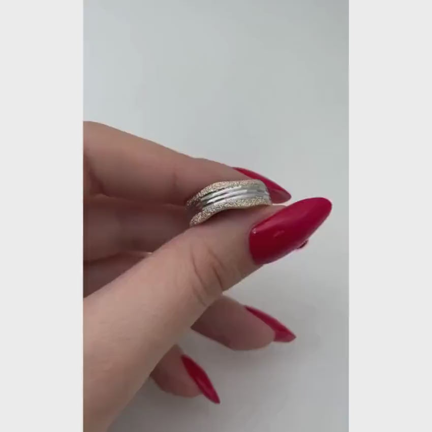 Load video: Yellow and White Gold Diamond-Cut Wavy Wedding Ring