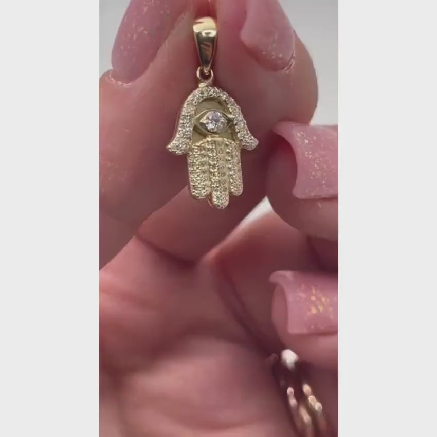 Load video: Diamond Studded Hamsa Evil Eye Pendant in 14K Gold with Large Central Diamond