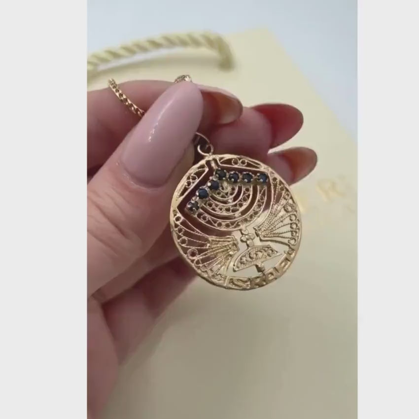 Load video: 14k Gold Round Menorah Pendant Reversible Ruby and Sapphire