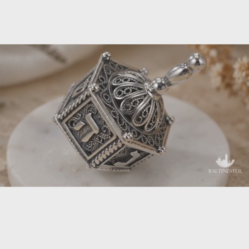 Load video: Hexagon Filigree Dreidel in Sterling Silver - Hollow Inside