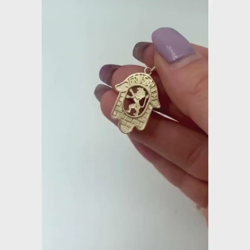 Load video: Hamsa Pendant in 14k Gold with Jerusalem, Lion and the Kotel